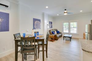a living room with a table and chairs and a couch at Coastal North Carolina Retreat - Walk to Beach! in Oak Island