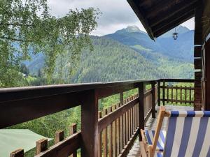 a balcony of a cabin with a view of mountains at Chalet Arêches-Beaufort, 4 pièces, 10 personnes - FR-1-342-224 in Beaufort