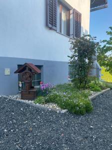 a small house with a bird feeder in a garden at Villa Marijana in Varaždinske Toplice