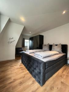 a bedroom with a large bed in a room at Ferienwohnung Zimmermann in Bad Schandau