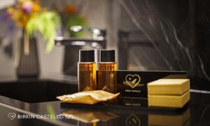 two bottles of essential oils sitting on a bathroom counter at Albergo Diffuso Birkin Castello in Cagliari