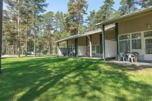 a house with a lawn in front of it at Villa Andropoff in Pärnu