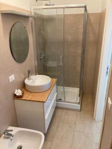 a bathroom with a sink and a shower at A Suata in Maratea