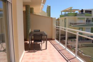 A balcony or terrace at Delfines III Solo Familias Serviplaya