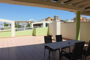 A balcony or terrace at Delfines III Solo Familias Serviplaya