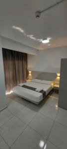 a bedroom with a bed in a room at La Veranda Hotel in Larnaca