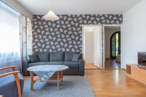 a living room with a couch and a table at Villa Andropoff in Pärnu