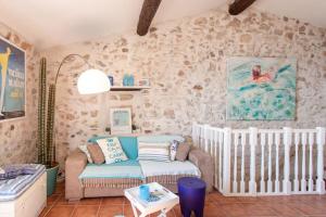 a living room with a couch and a crib at A9 - 1 BDR Fantastic Sea View Remparts Old Antibes - AC in Antibes