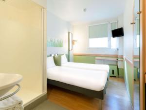 Posteľ alebo postele v izbe v ubytovaní Ibis Budget Madrid Centro Las Ventas
