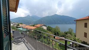 a balcony with a view of a lake and mountains at Il Mulino di Marena in San Siro