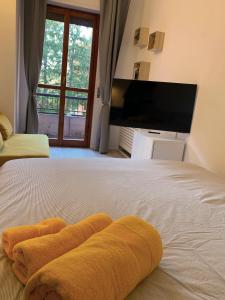 Letto o letti in una camera di Casa di Arianna in centro storico a Vimercate