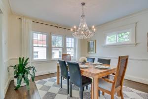 a dining room with a table and chairs and a chandelier at Pet-Friendly Cincinnati Retreat with Hot Tub in Blue Ash