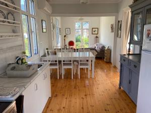 a kitchen and dining room with a table and chairs at Metropolis Villa in Vathi, Ithaka