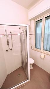 a bathroom with a shower and a toilet at Hotel Valente in Ortona
