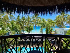 a view of the beach from the balcony of a resort at Red Coconut Beach Hotel Boracay in Boracay