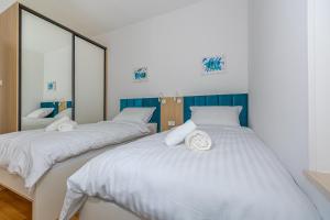 Postel nebo postele na pokoji v ubytování Villa Veronika Apartments