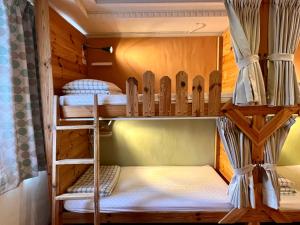 a bedroom with bunk beds in a cabin at Gift Box Hostel in Chishang