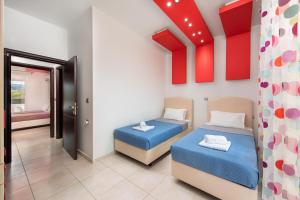 A bed or beds in a room at Marble Pool Villa