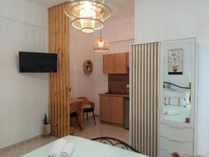 a room with a kitchen and a dining room at Vithos in Agnontas