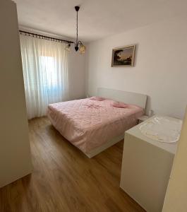 A bed or beds in a room at Apartment Ksenija