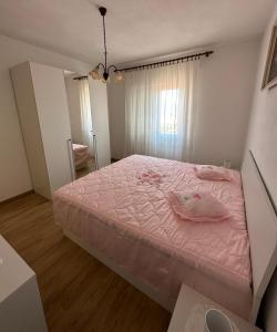 A bed or beds in a room at Apartment Ksenija