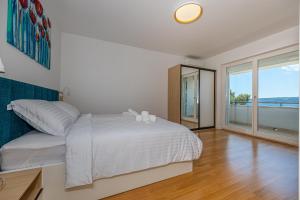 Postel nebo postele na pokoji v ubytování Villa Veronika Apartments