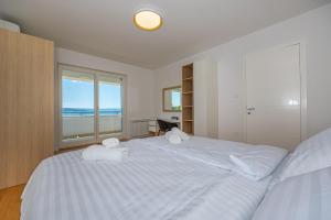 Postel nebo postele na pokoji v ubytování Villa Veronika Apartments