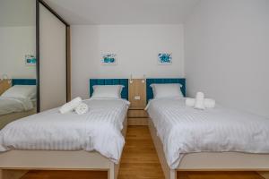 Postel nebo postele na pokoji v ubytování Villa Veronika Apartments