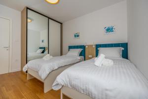 Postel nebo postele na pokoji v ubytování Villa Veronika Apartments