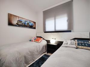Łóżko lub łóżka w pokoju w obiekcie SUNSET WAVES DReaM apartment