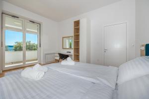 Postel nebo postele na pokoji v ubytování Villa Veronika Apartments + 37 fotografií