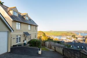 a house with a driveway in front of it at Old Sail Loft in Salcombe