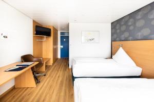 Postel nebo postele na pokoji v ubytování Hotel ISG Heidelberg + 21 fotografií