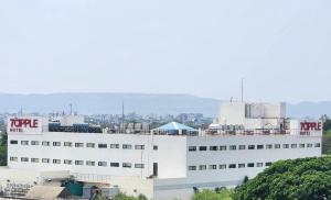 a white building with a tory sign on it at 7 Apple Hotel Aurangabad in Aurangabad +43 photos