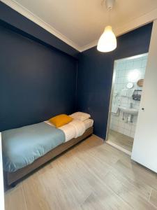 Ένα ή περισσότερα κρεβάτια σε δωμάτιο στο Hotel HEB