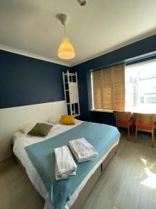 Ένα ή περισσότερα κρεβάτια σε δωμάτιο στο Hotel HEB