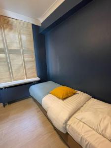 Ένα ή περισσότερα κρεβάτια σε δωμάτιο στο Hotel HEB