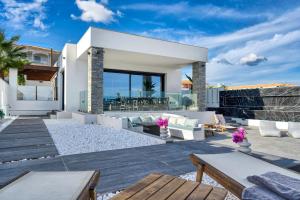 a villa with a view of the ocean at Villa V Beach Villa, All Inclusive Board, by ZanteWize in Laganas