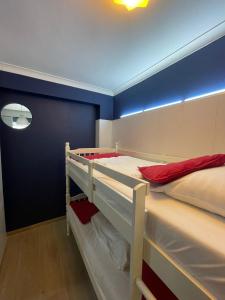 Ένα ή περισσότερα κρεβάτια σε δωμάτιο στο Hotel HEB
