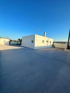 an empty parking lot in front of a building at Villa Santo Stefano in Monopoli