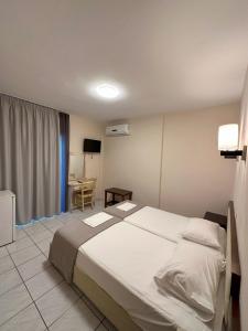 Posteľ alebo postele v izbe v ubytovaní Hotel Afrodite