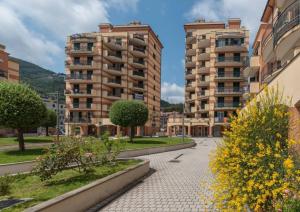 a street in a city with two tall buildings at GF Holiday Suite 3 in Varazze