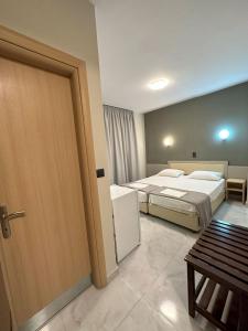 Posteľ alebo postele v izbe v ubytovaní Hotel Afrodite