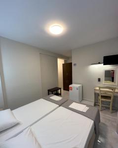 Posteľ alebo postele v izbe v ubytovaní Hotel Afrodite