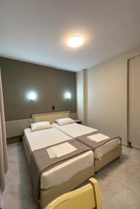 Posteľ alebo postele v izbe v ubytovaní Hotel Afrodite