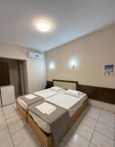 Posteľ alebo postele v izbe v ubytovaní Hotel Afrodite