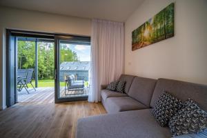 Posezení v ubytování Holiday House U Hájenky 11P Lipno Home