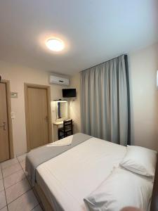 Posteľ alebo postele v izbe v ubytovaní Hotel Afrodite