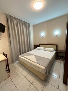 Posteľ alebo postele v izbe v ubytovaní Hotel Afrodite