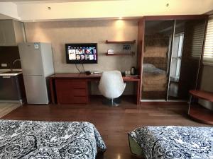Postel nebo postele na pokoji v ubytování Kaibin Apartment- Nanjing University Branch